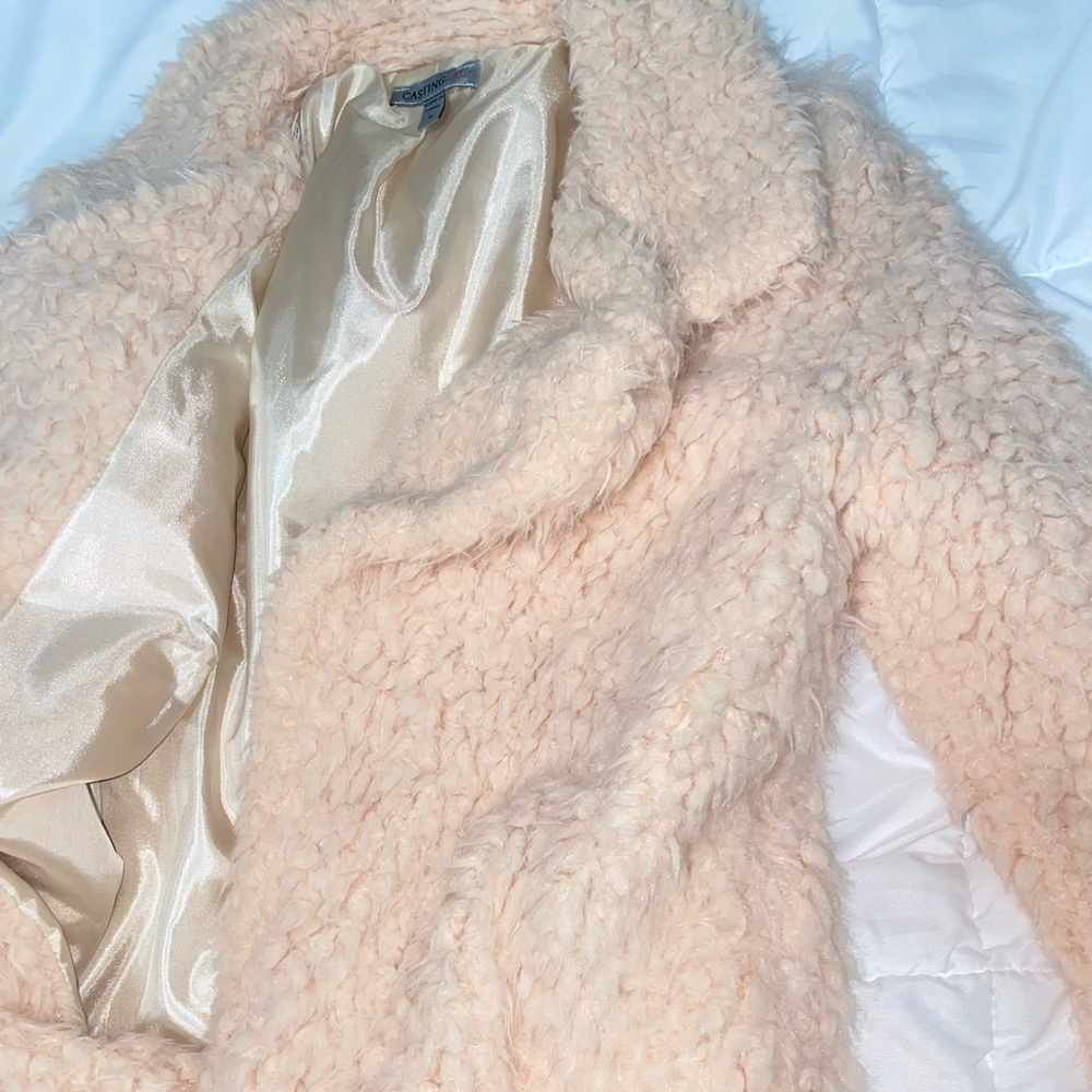Coat double lined , fuzzy .
